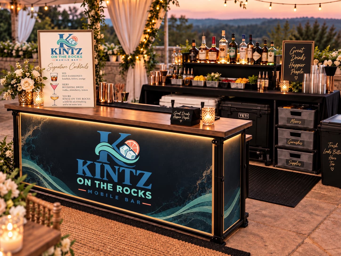 Kintz On The Rocks portable wedding bar glowing under string lights at dusk